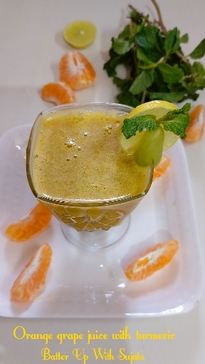 Orange Grape Juice With Fresh Turmeric Mint And Lemon / Vegan Drink